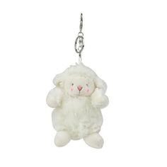 a white stuffed animal hanging from a metal hook