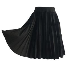 Alaïa black wool base pleated volumed circle skirt with high-rise waist. Double pleated design, very calculated contrasting silhouette. With Zip fastening at the back. Made in Italy. Size tag : 38 FR 80% wool, Polyamide 10%, viscose 5% and nylon 5% Measurements: Length : 51 cm Waist : 79 cm Alta Design, Volume Skirt, Black Cotton Skirt, Informal Dress, Azzedine Alaïa, Stella Tennant, Azzedine Alaia, Zipper Skirt, Jersey Skirt