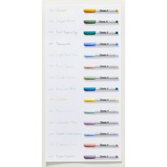 a white board with several different colored pens on it and the words written in each row