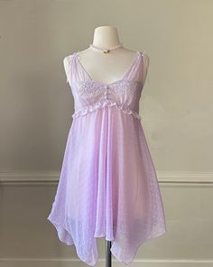 - Fairycore lilac purple slip dress featuring floral embroidery on bust with ruffled waist detail and fairy, polka dotscutout skirt- pearl buttons adorned; bows adorned; complete sheer fabric- size S - pristine condition with no visible damage or flaws 🤍 Size of mannequin: size 2 - 4 Fairy Slip Dress, Fairy Dress Outfit, Fairy Fits, Purple Slip Dress, Promotion Dresses, Halloween Group, Fairy Outfit, Dress Tutu, Group Costumes