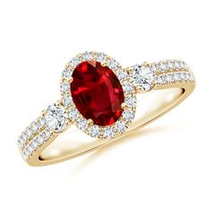 a red and white diamond ring with two diamonds on the band, set in yellow gold