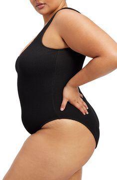 Created to fit every body, this shapely one-piece swimsuit is designed to adapt to your body's changes for the perfect fit every time. Full back coverage 95% polyester, 5% elastane Machine wash, dry flat Lined Imported Black Owned/Founded Black Bodysuit For Beach With Moderate Back Coverage, Black Bodysuit For The Beach With Moderate Back Coverage, Black Bodysuit With Moderate Back Coverage For Beach, Black Beachwear Bodysuit With Seamless Construction, Black Seamless Bodysuit For Beachwear, Black One-piece Elastane Bodysuit, Black Seamless Beachwear Bodysuit, Compressive One-piece Swimwear With Lined Body, Black Seamless One-piece Swimwear