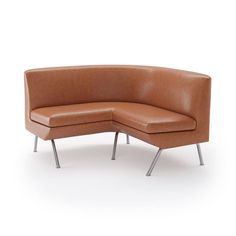 a brown leather corner sofa sitting on top of a metal frame chair with two legs