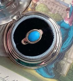 If you are a Jane Austen lover (like me!) or a lover of all things Georgian (also, like me!) then you are sure to swoon over this 'robin egg blue' Persian turquoise solitaire ring that is incredibly similar to Jane Austen's ring housed in Chawton UK, and which was, indeed, made in the same period as hers! Dating from the mid-1770s--the start of the Neoclassical aesthetic in Georgian era design of the 18th century--this ring may be understated in structure but the bright blue of the turquoise pac Antique Oval Turquoise Ring Hallmarked, Antique Oval Turquoise Ring, Vintage Turquoise Promise Ring, Turquoise Vintage Promise Ring, Antique Hallmarked Turquoise Ring, Antique Turquoise Gemstone Ring For Formal Occasions, Antique Turquoise Anniversary Ring, Heirloom Style Hallmarked Turquoise Ring For Formal Occasions, Heirloom Hallmarked Turquoise Ring For Formal Occasions