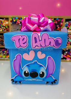 a blue box with a pink bow on it