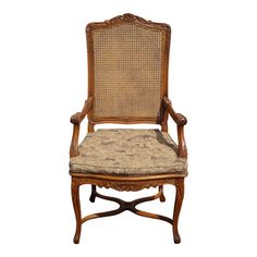 an antique chair with cane back and upholstered seat, in the style of louis ii