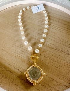 Freshwater pearls and a gold bezeled buffalo coin pendant with toggle closure. Emerald Coast, Coin Pendant, Fresh Water, Freshwater Pearls, Buffalo, Coin, Pendant, Gold