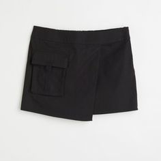 Size Xs, Skirt In A Cotton Weave. Regular Waist With Covered Elastication At The Back And A Sewn-In Wrapover At The Front. Concealed Zip In One Side And A Patch Front Pocket With A Flap. New With Tags Casual Skirt With Built-in Shorts For Work, Black Short Cargo Skirt For Spring, Chic Black Cargo Skirt With Side Pockets, Black Spring Skort With Side Pockets, Black Skort (shorts With Skirt Shape), H&m Mini Length Bottoms For Summer, H&m Summer Skort Short Length, H&m Mini Skort For Summer, H&m Summer Mini Length Bottoms