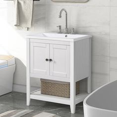 a bathroom with a sink, mirror and bathtub in it's corner next to a towel rack