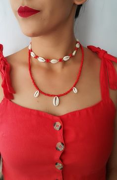 Natural Shell Adjustable Seashell necklace Top Beautiful choker necklace ♥ White color natural shells (with 10 pieces natural cowrie ) ( shells). coral color seed bead ♥min lenght 13 inch ---- max lenght 28 inch ♥ Coral color seed bead necklace 1 big-2 small cowrie- 21 inch ♥Can be worn in different lengths to fit your each time needs. Adjustable closure that tightens and looses with ease for the perfect fit. Just pull the endings and the necklace will close on the length you wish. ♥min lenght 1 Cheap Round Beads Shell Necklace For Vacation, Affordable Handmade Shell Choker Necklace, Summer Ocean-inspired Necklaces, Adjustable Shell Necklace For Summer Festivals, Bohemian Beaded Choker With Clavicle Chain, Shell Clavicle Chain Jewelry For Beach, Beach Shell Clavicle Chain Jewelry, Beach Season Strand Necklaces, Beach Shell-shaped Necklace With Clavicle Chain