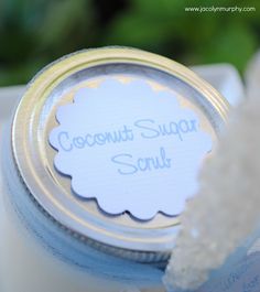 there is a small jar with some sugar in it and the label says coconut sugar scrubs