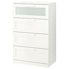 a white chest of drawers with three drawers