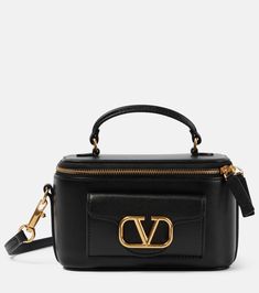 VLogo Locò Mini leather makeup bag in black - Valentino Garavani | Mytheresa Black Designer Bags, Valentino Purse, Limousine Car, Valentino Garavani Bag, Leather Makeup Bag, V Logo, Girly Bags, Unique Shapes, Bag Collection