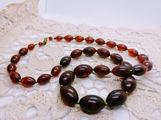 Antique necklace in vintage transparent cognac marble lucite beads, vintage 40-50s necklace in marbled cognac lucite, vintage women's necklace Vintage 40-50s materials: old plastic, lucite, semichrome test on bakelite negative Color: brandy Length 62cm Beads are large oval - the largest 2.5x1.7 cm screw brass clasp very pretty vintage cognac-colored necklace, the pearls are transparent marbled give a very pleasant atmosphere! Good gift for women, good addition to your BOHO style wardrobe Retro Brown Necklace For Gift, Vintage Amber Jewelry With Large Beads, Retro Bakelite Jewelry As Gift, Vintage Baltic Amber Jewelry For Formal Occasions, Vintage Amber Beaded Necklace, Handmade Vintage Brown Jewelry, Vintage Formal Necklaces With Polished Beads, Vintage Amber Beaded Necklaces, Classic Handmade Amber Necklaces