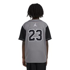 Baseball vibes with a basketball legacy. Showcase your love for both games in the Jordan HBR Baseball Jersey. Made with lightweight fabric, this jersey buttons down the front. It features heat-sealed Jordan and 23 logos on the front and back. Pair it with your AJ1s for a look worth posting on your socials. Button down jersey. Heat-sealed appliques logos at the front and back. Imported. Varsity Basketball Jersey, Varsity Basketball Jersey For Sports Season, Varsity Basketball Jersey Tops, Basketball Team Jersey Tops, Varsity Basketball Top With Moisture-wicking, College Sports Season Jersey With Moisture-wicking, Varsity Sports Jersey With Letter Print, Varsity Style Sports Jersey With Letter Print, Varsity Basketball Tops With Moisture-wicking