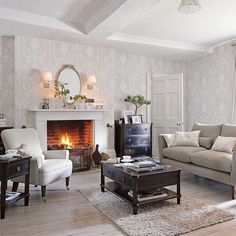 a living room filled with furniture and a fire place