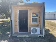 a tiny house with an air conditioner in it