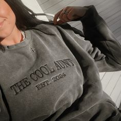 Comfort Color® Embroidered Cool Aunt Club Sweatshirt is the perfect blend of style, comfort, and personalized charm. Featuring an embroidered "Cool Aunt Club" design, it celebrates the special bond between aunt and niece/nephew. But the customization doesn't end there – you can add a custom est year or children's names on the sleeve, making each sweatshirt a unique gift. Available exclusively on embroly.com, this auntie sweatshirt is a must-have for proud aunts everywhere. Visit the website and Cool Aunt Club, The Cool Aunt, Aunt Sweatshirt, Children Names, Cool Aunt, New Aunt, Club Sweatshirts, Aunt Gifts, Embroidered Sweatshirt