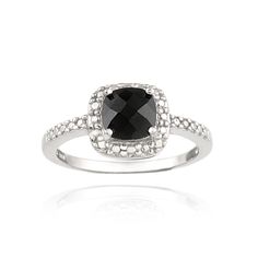 This delicate ring features a faceted black spinel stone prong set surrounded by a silver pave border. There is one genuine diamond nestled within the dotted pattern. The dainty ring is crafted of tarnish resistant sterling silver. Black spinel stone size is 7x7mm. Total gem weight: 2ct. Total diamond weight: .01ct. Product Details Metal Type sterling-silver Metal Stamp 925-sterling Weight 3.5GR Width 10.25MM Height 0MM Stone Details Gem Type spinel Number of Stones 1 Stone Color black Stone Sha Diamond Leaf Ring, Spinel Stone, Black Spinel Ring, Square Diamond Rings, Spinel Ring, Morganite Diamond, Zierlicher Ring, Aquamarine Engagement Ring, Square Ring