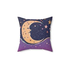 a pillow with the moon and stars on it