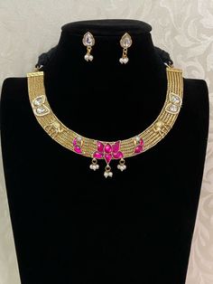 A Kundan Hasli necklace is known for its intricate design and craftsmanship, making it a cherished piece in traditional Indian jewelry collections. white& gold Traditional Kundan Hasli Hasli Necklace, Traditional Indian Jewellery, Goddess Dress, Kundan Earrings, Finger Rings, Cz Earrings, Antique Earrings, American Diamond, Traditional Indian