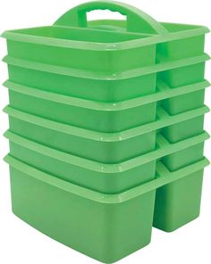 green plastic storage containers stacked on top of each other