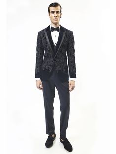 Our Astral handcrafted embellish tuxedo is highlighted with metallic crystals. Single-button satin details on peak collar. This luxurious velvet jacket can be paired with flat-front trousers making it perfect for a cocktail or an evening look. Luxury Long Sleeve Suits For Party, Luxury Long Sleeve Party Suits, Luxury Party Suits, Glamorous Fitted Evening Suit, Party Suits With Embellished Notch Lapel, Tailored Glamorous Evening Suits, Fitted Sequin Suits For Night Out, Glamorous Tailored Evening Suits, Fitted Embellished Suits For Night Out