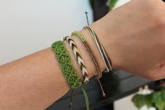 Set of 4 stacking bracelets with different syles that look great together or mix with others. This vsco style bracelet set is handcrafted using brazilian wax thread in different shades of green and brown. You can even shower or swim with these cord bracelets on because they are waterproof, which makes them the perfect jewelry for the summer and the beach. Since the bracelets are adjustable with a sliding knot, they are also easily taken on and off.  You can were them alone or stack with other br Cheap Green Casual Friendship Bracelets, Cheap Green Braided Bracelets For Women, Handmade Green Wrap Bracelet For Friendship, Green Handmade Wrap Bracelet For Friendship, Hippie Green Bracelets For Beach, Green Hand Wrapped Friendship Bracelets, Hand Wrapped Green Friendship Bracelets, Hippie Green Bracelet For Beach, Green Hippie Beach Bracelets