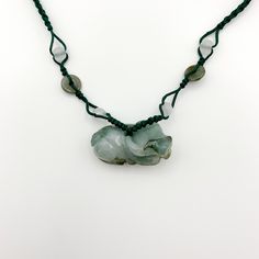 This is a high grade jadeite jade pendant necklace. It is exquisitely hand carved, so each pendant is different in some way. The pendant is completely natural jade, un-dyed and in its natural form. The pendant is carved in the form of the Chinese Zodiac - Ox. The necklace is adjustable - one size fits all. It comes with a gift box. The item is hand carved and natural so it may have imperfections because of the nature of stone or the carving - part of the charm of carved jade! Pictures are of the Jade Amulet Pendant Necklace, Unique Jade Necklace With Round Pendant, Jade Necklace With Round Pendant, Jade Gemstone Amulet Necklace, Jade Amulet Necklaces With Gemstones, Jade Gemstone Amulet Necklaces, Handmade Jade Necklaces For Good Luck, Carved Jade Pendant Necklace, Carved Jade Pendant Jewelry