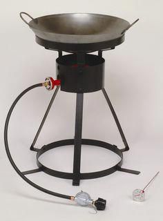 an outdoor cooking stove with the lid open