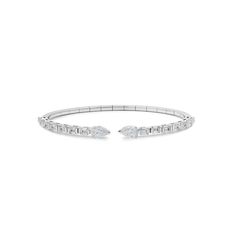 The White Gold Diamond Cuff Bracelet is an ideal layering piece. This elegant open-style cuff features baguette diamonds. Its modern spring system and timeless design make it an ideal addition to your jewelry collection. Details:18K White Gold3.65 Carats of DiamondsDiamond Quality F-G color, VVS-VS ClarityManufactured in Italy Modern Baguette Cut Diamond Bracelet, Modern Formal Bracelet With Baguette Diamonds, Luxury Baguette Diamond Bangle For Formal Events, Modern Formal Bracelets With Baguette Diamonds, Modern Wedding Tennis Bracelet With Baguette Diamonds, Modern Tennis Bracelet With Baguette Diamonds For Wedding, Modern Baguette Cut Wedding Bracelet, Modern Diamond Bangle With Baguette Cut, Modern Baguette Cut Diamond Bangle