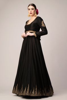 Black silk anarkali with temple border and back tassel tie-up. Paired with net golden embroidered dupatta.
Components:2
Pattern:Embroidered
Type of Work:Geometric
Neckline:Scoop
Sleeve Type:Full Sleeves
Fabric:Anarkali: Chanderi, Dupatta: Net
Color:Black
Other Details:
Embroidered dupatta
Back tassel tie-up
Occasion:Sangeet - Aza Fashions Black Gown With Dabka Work For Reception, Traditional Formal Lehenga Maxi Length, Traditional Formal Maxi Length Lehenga, Formal Resham Embroidered Anarkali Set For Navratri, Formal Lehenga With Dupatta In Maxi Length, Formal Lehenga With Dupatta Maxi Length, Formal Black Floor-length Sharara, Elegant Black Gown For Diwali, Unstitched Anarkali Choli For Formal Occasions