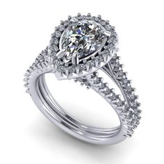 a diamond engagement ring set with an oval shaped center and side stones on the band