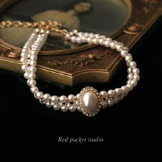 It is a perfect accessory for weddings, formal occasions, or any event where you want to make a statement. This sophisticated choker is designed to showcase your elegance and charm. Features: Material: Artificial pearls and alloy Chain style: Round pearl chain Length: 33cm + 11cm adjustable Weight: 38g Multi-layered with a pendant Pendant Material: Alloy Circumference: 21cm (inclusive) - 50cm (inclusive) With its vintage pearl design and delicate craftsmanship, this unique choker exudes a timele Luxury Vintage Necklace Collection, Luxury Victorian Chain Necklace As Gift, Luxury Temple Jewelry Wedding Choker, Luxury Antique Pearl Chain Necklaces, Luxury Victorian Antique Finish Necklace, Luxury Traditional Necklaces With Historical Design, Luxury Elegant Pearl Necklace For Layering, Luxury Jewelry With Historical Baroque Design, Luxury White Elegant Kundan Necklace