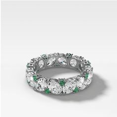 A stunning blend of big oval diamonds and small green emerald rounds, this medley of gems serves as a chic alternative to a standard eternity band. 3.8mm wide Stacking Rings Wedding, Colored Diamond Engagement Rings, Emerald Cut Eternity Band, Pave Diamond Wedding Bands, Sapphire Eternity Band, Colored Stone Rings, Side Stone Engagement Ring, Pink Sapphire Ring, Sapphire Engagement Ring Blue