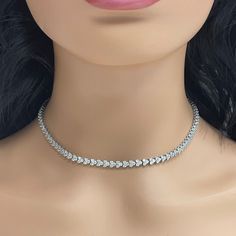 A classic and elegant everyday or occasional wear the Directions Diamond Tennis Necklace is a timeless and versatile piece of jewelry. All our necklaces have two locks for added security. Total Diamond Weight: 9.00 ct Diamond Color: H - I Diamond Clarity: SI - I (Slightly Included - Included) Metal: 14K White Gold Metal Wt: 21.30 gms Setting: Prong Set Length: 16 Inches (40.6 cm) Classic Silver Single Strand Diamond Necklace, Formal Single Strand Diamond Chain Necklace, Classic Single Strand Diamond White Necklace, Classic Choker Necklace For Formal Occasions, Classic Formal Choker Necklace, Anniversary Single Strand Cubic Zirconia Necklace, Single Strand Cubic Zirconia Necklace For Anniversary, Elegant Diamond Choker Jewelry, Classic Single Strand Cubic Zirconia Necklace