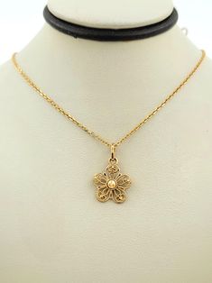 Gorgeous Vintage 1990s Handmade 14K Solid Yellow Gold Flower Necklace Perfect gift for your loved one!  This necklace is unique because of the attention in detail to the pendant  Chain length: 16 inches Chain thickness approx.: 0.65mm The pendant measures approx.: 15.1mm x 12.5mm Total necklace weight approx.: 2.7g Hallmarks on the chain: 14K  Will be placed into a suitable gift box Free shipping within the U.S. Yellow Gold Flower Necklace For Formal Occasions, Gold Flower Necklace In 14k Gold, Hallmarked Yellow Gold Flower Pendant Necklace, Yellow Gold Flower Pendant Necklace, Elegant Gold Flower Pendant Necklace, Elegant 14k Stamped Flower Pendant Jewelry, Yellow Gold Filigree Flower Pendant Jewelry, Gold Flower Pendant Necklace In Fine Jewelry Style, Yellow Gold Flower Charm Necklace For Anniversary