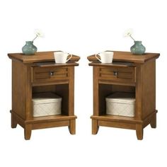 two wooden nightstands side by side with cups on them