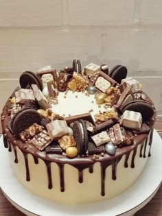 a cake with chocolate and cookies on it