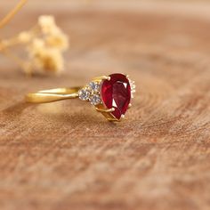 Natural Red ruby ring for women, Red rose ruby ring for her, Engagement ring, Wedding ring, Purpose ring, Promise ring, Statement ring, Gift for her. *Other Similar Jewelry Available Here* https://www.etsy.com/shop/AreebaJewelry Details:- Gemstone - Red Stone Color Available - Natural Red Stone Setting - Prong Quality - AAA Grade Stone Size - 5 x 7 MM Rize Size - 5 US TO 9 US Available Type - 100% Natural  Shipping service - Free worldwide shipping service About AreebaJewelry:- AreebaJewelry tak Red Open Diamond Promise Ring, Ruby Birthstone Open Ring, Classic Red Pear-shaped Rings, Classic Pear-shaped Red Rings, Fine Jewelry Ruby Diamond Ring Gift, Ruby And Diamond Proposal Ring, Elegant Ruby Ring For Proposal, Red Ruby Open Diamond Ring, Classic Ruby Ring With Pear-shaped Stone