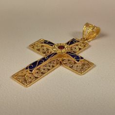 Byzantine style Cross made of 18 ct. solid yellow gold The Cross consists of two different pieces, the basic Cross which is decorated with different sizes filigree work spirals, and the upper part, the second Cross Has a flower in the center and is adorned with blue and red enamel The cross is made in Greece, in one of the oldest goldsmith workshops that specializes in making filigree An amazing handmade byzantine cross that can be a special gift for any special occasion ( The price does not inc Antique Yellow Gold Jewelry With Meenakari, Luxury Gold Jewelry With Historical Design, Byzantine Cross Jewelry For Ceremonial Occasions, Traditional Hallmarked Enamel Jewelry, Luxury Gold Meenakari Jewelry, Luxury Gold Jewelry With Meenakari, Traditional Cross Jewelry With Intricate Design, Traditional Cross Pendant For Ceremonial Occasions, Traditional Yellow Gold Cross Pendant Jewelry