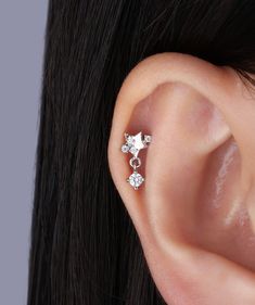 Transform into a celestial beauty with our twinkling star drop earrings. These small yet exquisite pieces will add a touch of elegance to any outfit, ensuring you stand out from the crowd. Embrace luxury and sophistication with these must-have accessories. Detail： -Post material: gold plated with internal stainless steel or stainless steel. Cubic Zirconia -Gauge: 16g | 1.2mm-Post length: 6mm-Top dimensions: 5.2mm Length x 5.3mm Width -Include: single item -Closure: screw ball back * Shop extra b Elegant Silver Jewelry With Star Charm, Elegant Star-shaped Pierced Jewelry, Elegant Dangle Piercings As A Gift, Elegant Dangle Piercings Gift, Elegant Star Shaped Cartilage Earrings With Star Charm, Elegant Star Charm Cartilage Earrings, Elegant Silver Earrings With Star Charm, Star-shaped Cubic Zirconia Jewelry With Matching Earrings, Elegant Silver Hypoallergenic Piercings