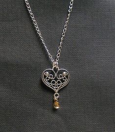 Astrid  Traditional Norwegian Antique by KAStrainKreations on Etsy Elegant Handmade Heart Pendant Charm Necklace, Elegant Nickel-free Heart Necklace, Elegant Filigree Heart Necklace As A Gift, Silver Teardrop Necklace With Heart Charm, Elegant Nickel-free Heart Pendant Necklace, Elegant Teardrop Necklace With Heart Charm, Elegant Heart Pendant Necklace With Lobster Clasp, Elegant Wire Wrapped Necklaces For Valentine's Day, Sterling Silver Heart Necklace Wire Wrapped