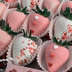 chocolate covered strawberries with hearts and sprinkles on them in a box