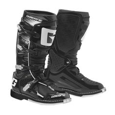 a pair of black and white motorcycle boots