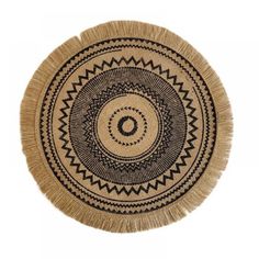 a black and white circular rug with fringes