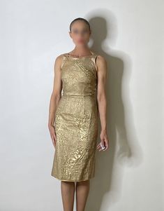 "An exceptional Y2K designer vintage dinner or cocktail dress in gold.  The fabric here is so unique - it is textured and there are panels of different plain textured metallic fabric. Amazing details and elegant classic silhouette.  Size  12 1/4\" waist 38 1/4\" long  XXS  Condition Worn seldom, light pilling very occasional seen on close up examination only. Presents beautifully.  Model is  24\" waist 5' 6\" 54kg SHIPPING PLEASE READ This item is located in Australia - we charge only the actual postage cost to send internationally. Once any item is sent if the postage charged is higher than we paid we will refund any difference. In most cases the postage cost will be higher than our postal charges - the fact is that postage is expensive and international postage for garments or heavier it Gold Evening Dress, Vintage Dinner, Gold Evening Dresses, Gold Lame, Evening Dresses Cocktail, Dress Gold, Metallic Fabric, Dress Cocktail, Designer Vintage