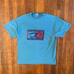 Dope Washington DC T-shirt from the '90s. Big spellout and graphic on front. Beautiful cyan color. Amazing condition. Tagged an XXL but fits like an XL.  Brand: Delta Size: XL Color: Blue, Multi Condition: Excellent 90s Style Blue T-shirt With Text Print, 90s Blue Logo Print T-shirt, 90s Blue T-shirt With Text Print, 90s Blue Short Sleeve T-shirt, 90s Style Blue Short Sleeve T-shirt, Fsu Shirts, Vintage Washington Dc, Pittsburgh Steelers Hats, Cyan Color