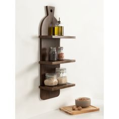 a wooden shelf with jars and spices on it