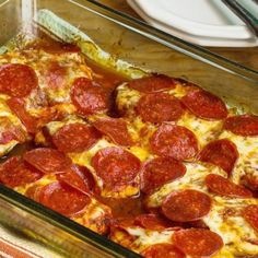 a pepperoni pizza in a glass baking dish